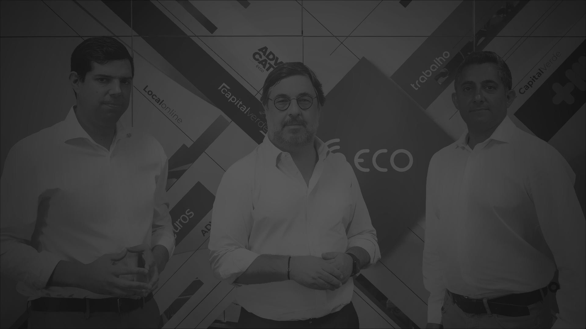 ECO team members in white shirts stand together in front of a colorful corporate backdrop.
