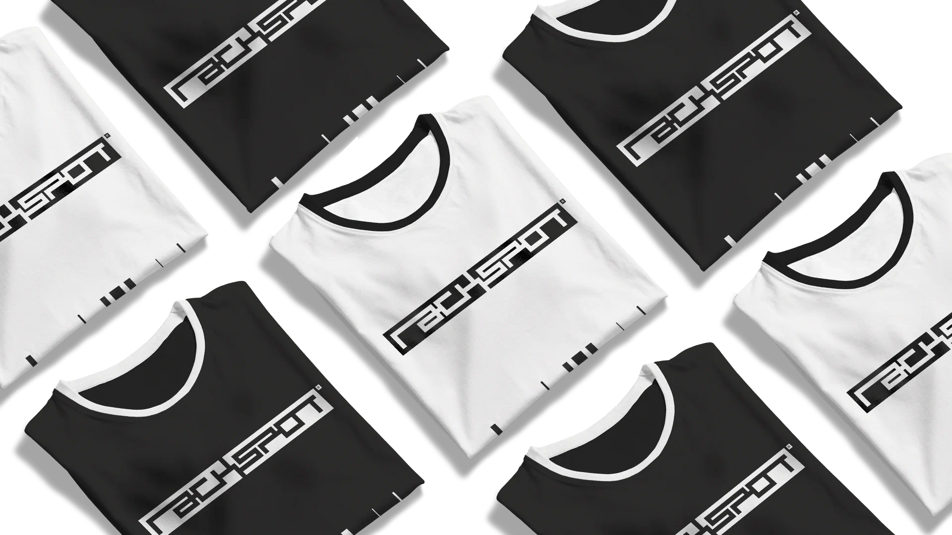 Folded black and white t-shirts featuring "Rackspot" logo across the front, arranged stylishly.